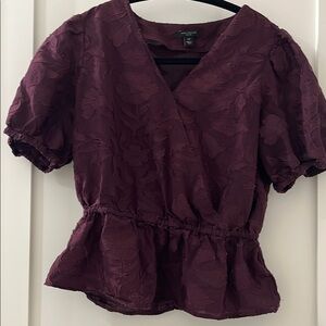 Purple V-neck puff sleeve blouse with peplum style